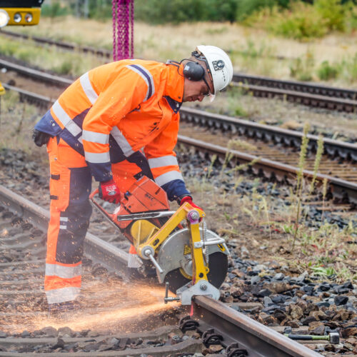 Roßlau, Germany, September 13, 2018 - A construction worker cuts a railroad track at the freight yard in Roßlau (Saxony-Anhalt).