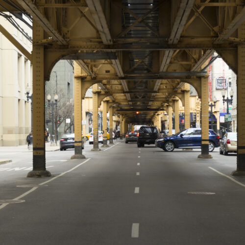 Chicago,IL, USA - April 24,2018 : Street view of Chicago downtown under elevated train station in Chicago,USA on April 24,2018.